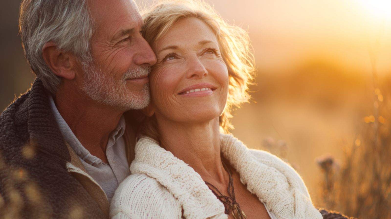 мужчина и женщина лет 60 сидят на закате